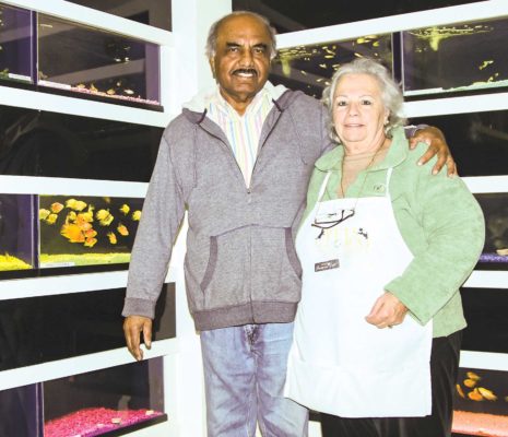 Pet Mart owners Abu and Maria Siddia, with their 50 aquariums in 2019. Easy Reader file photo