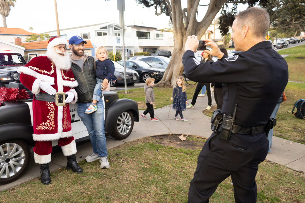 Hermosa Beach Police Chief Paul LeBaron served as Santa's chauffer, and photographer during Santa's tour through Hermosa Beach last week.