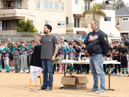 Triple Bueno's Zeal Levin sings the National Anthem.